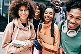 Five smiling Black college students male and female.