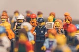 A set of lego figures focused on the figures on the center.