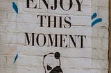 pic says “Enjoy This Moment”