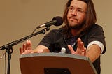 david foster wallace standing at a lectern