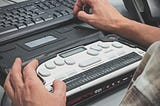 image of someone using a braille screen reader