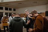 a group session bowed in prayer