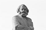 A stone statue of Karl Marx
