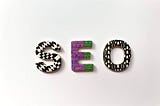 Three letters spelling SEO with patterns and designs.