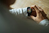 Man using black Apple Watch