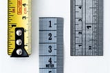 Measuring tapes signifying measurements and metrics