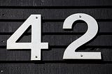 this is a photo of a wall with the number 42 attached to it.