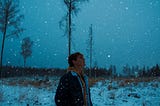 Image of a woman taking a stroll on a snowy winter day