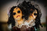 Yellow dolls that look alike, with curly black hair