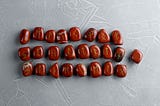 Red Rune Stones laid out in three rows with one separate from the rest