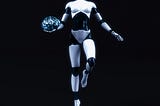 Robot figure holding a brain in their right hand.