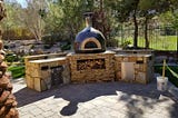 Outdoor Fireplace Ideas in Las Vegas with Chimney and Pizza Oven