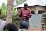 William Musoni during one of his workshops encouraging members of his community to adopt improved WASH practices including handwashing