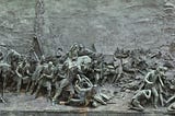 Bas-relief stone mural of revolutionary war.