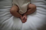Baby feet on a soft blanket-what ever person struggling with infertility dreams of.