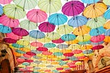 photo of pastel colored umbrellas