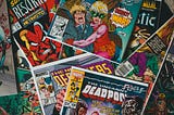 A scattered assortment of comic books.