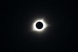 The sun being blocked out by the moon.