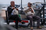 men on a bench
