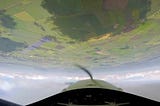 Flying Inverted Over Green Fields — author’s image