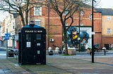 Doctor Who’s Tardis on a city street.
