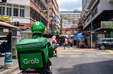 A Grab driver that bring food for completing delivery order request