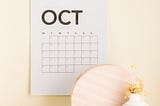 a calendar on the wall showing the month of October