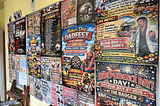 AI-created posters tacked to a wall that all look similar