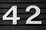 A picture of the number 42 on a house, presumably the the house’s street number.