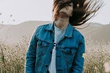 image of woman tossing hair around