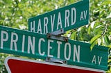 Two signs at an intersection read ‘Harvard Av’ and ‘Princeton Av’