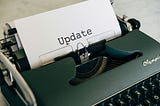 A typewriter with the word “update”