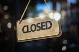 A sign reading “Closed”