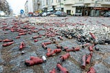 A city street covered in the debris of many explosives