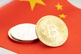 China should reconsider its ban on cryptocurrencies, says former central bank official