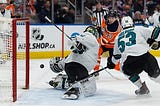 Edmonton Oilers' Ryan Nugent Hopkins (93) is stopped by San Jose Sharks goalkeeper Kabo Kahkkonen (34) during the first period of NHL games at Rogers Place in Edmonton, Thursday, March 24, 2022.