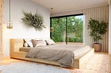 A nature-inspired primary bedroom featuring a custom wood bedframe, grey linen bedding and a sculptural wall-based flower arrangement made from dried wildflowers and plants native to California.