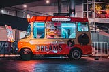 A Jest. An icecream truck with a sign “Dreams” showing on its side.
