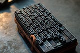 Old printing press letters sitting on a table