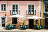 A typical Portuguese street scene, very neatly arranged. Perhaps just for show, as the story suggests?