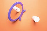 A vibrant purple mirror and skincare products are arranged against a warm orange background.