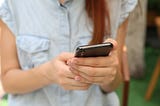 A girl holding a phone