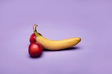 Photo of a banana and two nectarines with a purple background. Alt text to demonstrate the importance of alt text.