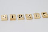Scrabble tiles spelling out the word Simple
