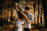 A couple dancing in the woods