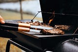 grill with burgers