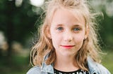 young girl with blonde hair and blue eyes