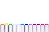 A row of pens inked in a variety of colours.