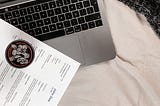 A CV on top of a laptop