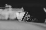 blurry image of someone sitting in a car